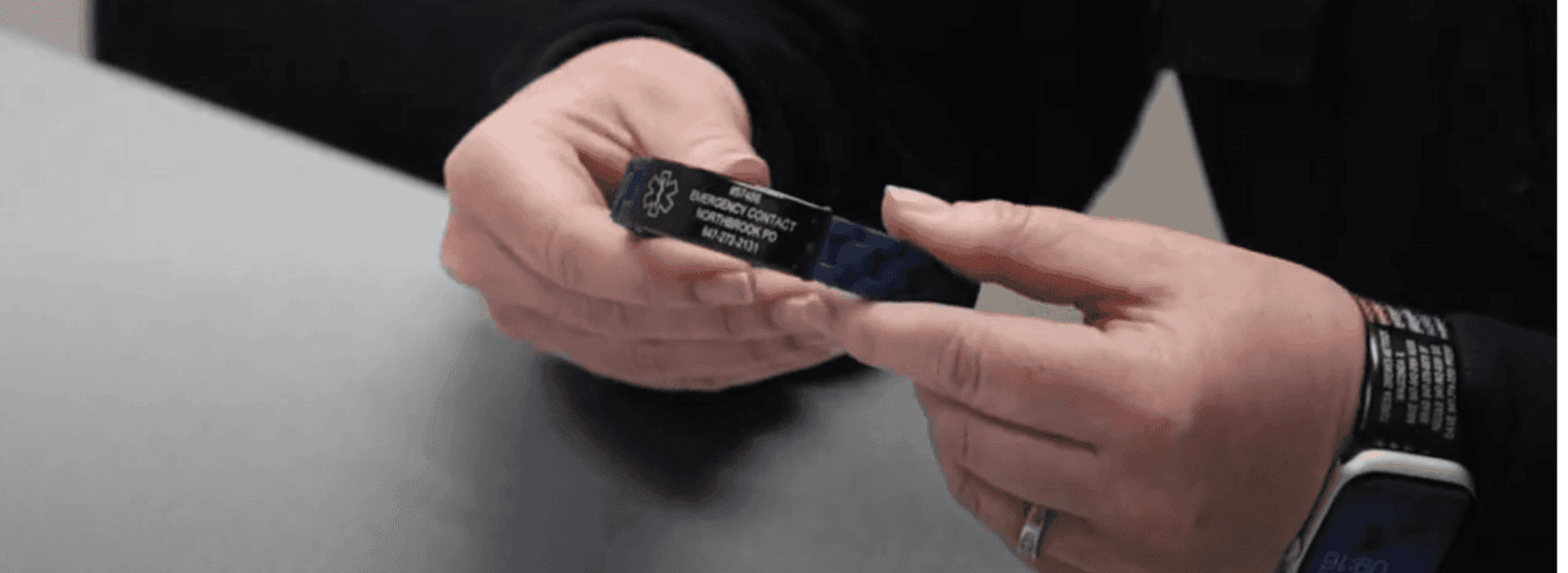 Northbrook ID Bracelet being held
